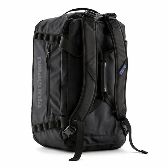Black Patagonia Black Hole 40L duffel bag showing padded backpack straps, reinforced haul handles, and side daisy chains.