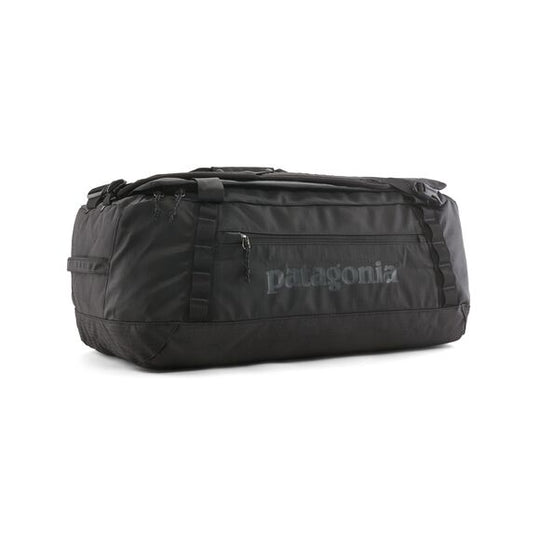 Black Patagonia Black Hole 55L duffel bag in weather-resistant ripstop fabric with side pocket and daisy chains.