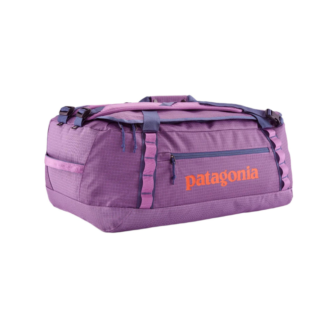 Purple Patagonia Black Hole 55L duffel bag in weather-resistant ripstop fabric with daisy chains and orange logo.