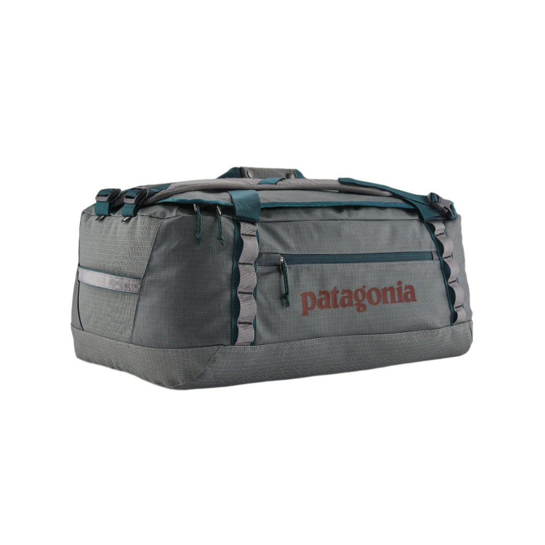 Grey Patagonia Black Hole 55L duffel bag in weather-resistant ripstop fabric with reinforced daisy chains and side pocket.