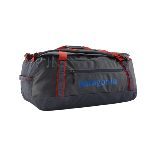 Patagonia Black Hole 55L duffel bag in dark grey with red straps, blue logo, and durable weather-resistant ripstop fabric.