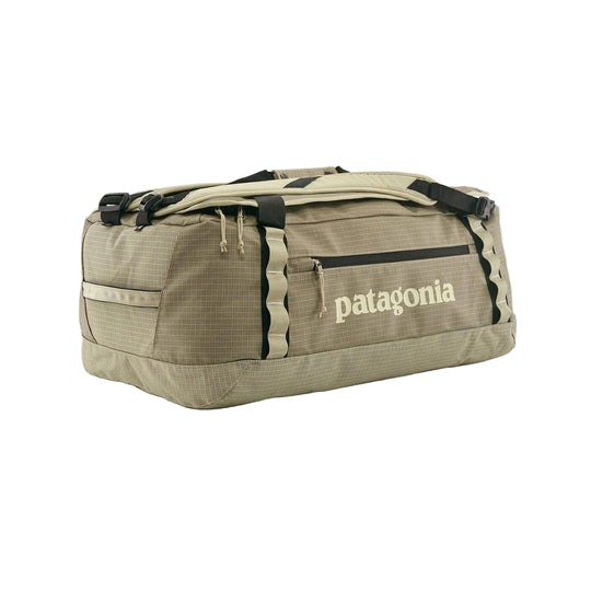 Tan Patagonia Black Hole 55L duffel bag in durable ripstop fabric with side zipper pocket and reinforced daisy chains.