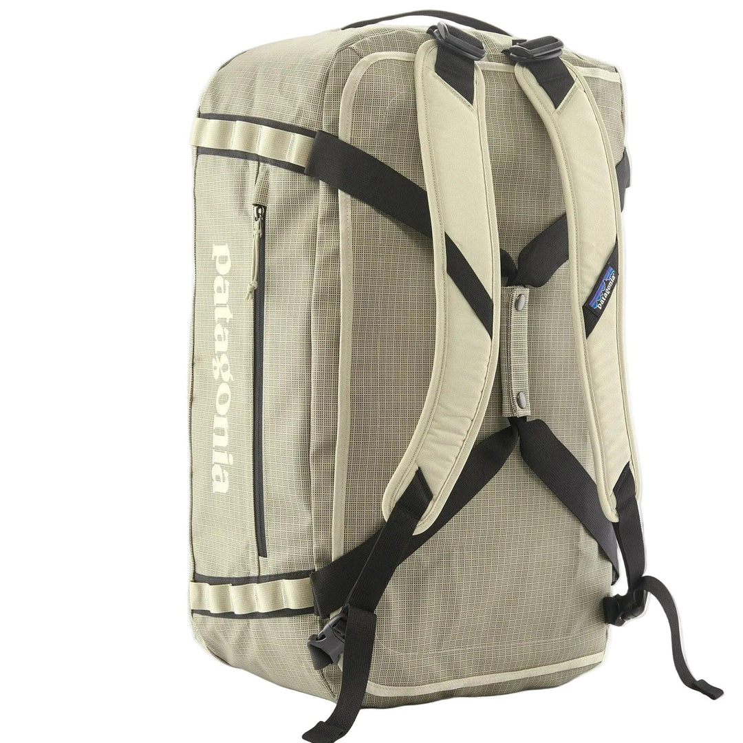 Tan Patagonia Black Hole 55L duffel bag with backpack straps, side zipper pocket, and durable ripstop fabric.
