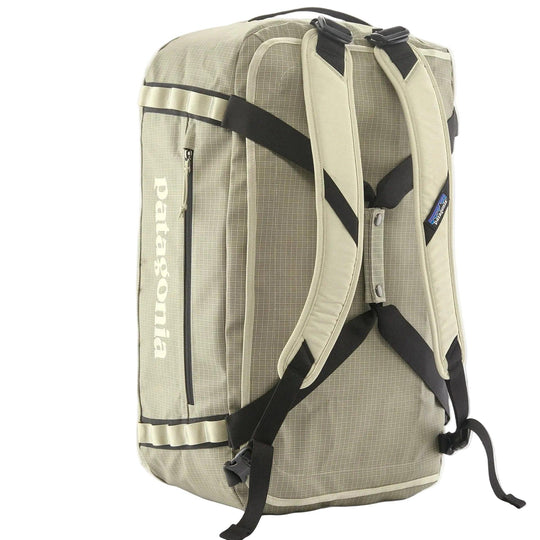 Tan Patagonia Black Hole 55L duffel bag with backpack straps, side zipper pocket, and durable ripstop fabric.