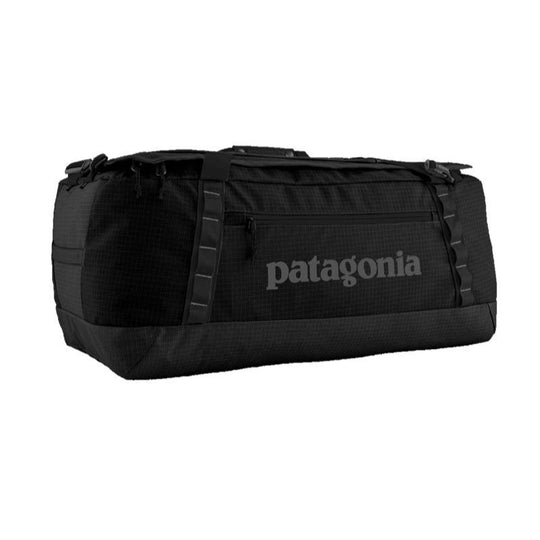 Black Patagonia Black Hole 70L duffel bag with a matte finish, daisy chains, and a front zippered pocket on a white background.