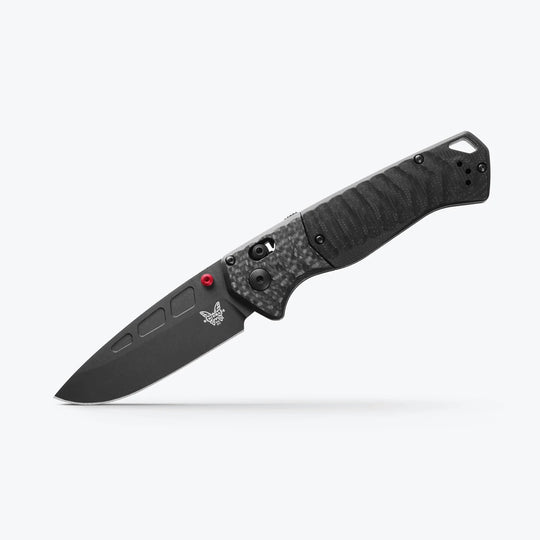 Benchmade 593 PSK folding knife with black Cerakote blade, carbon fiber handle, and red thumb stud on a white background.