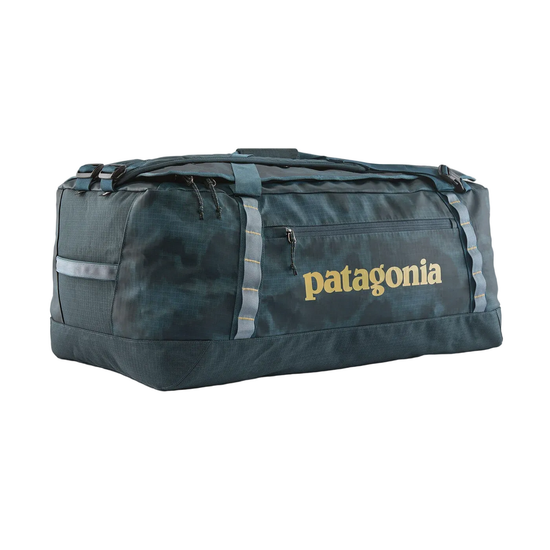 Patagonia Black Hole 70L duffel bag in dark blue camo with durable recycled fabric, side pocket, and daisy chain loops.