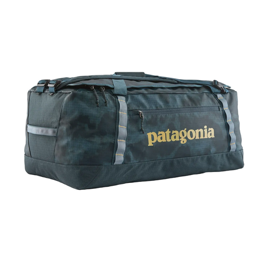 Patagonia Black Hole 70L duffel bag in dark blue camo with durable recycled fabric, side pocket, and daisy chain loops.