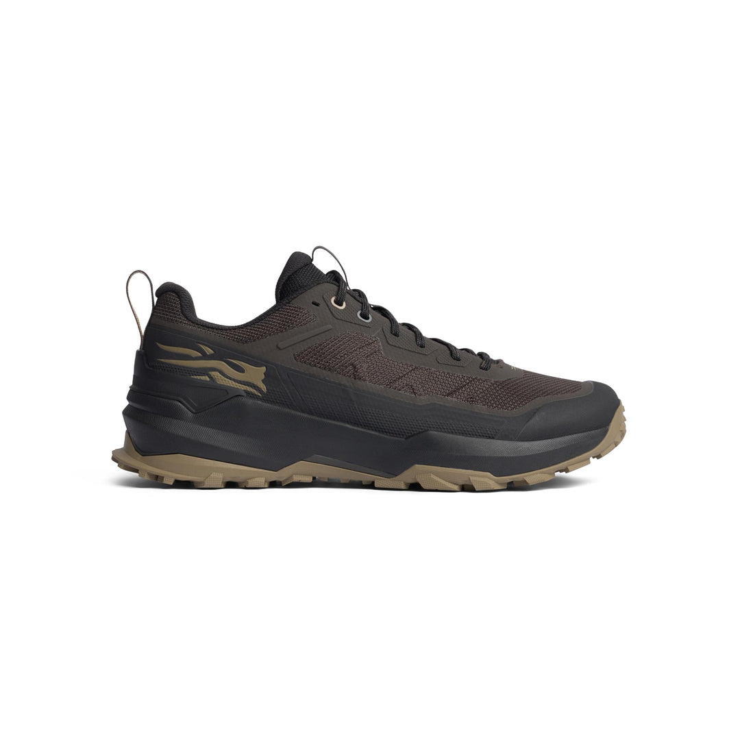 A single trail running shoe in dark brown and black with a tan outsole, shown in a side profile view against a plain white background.