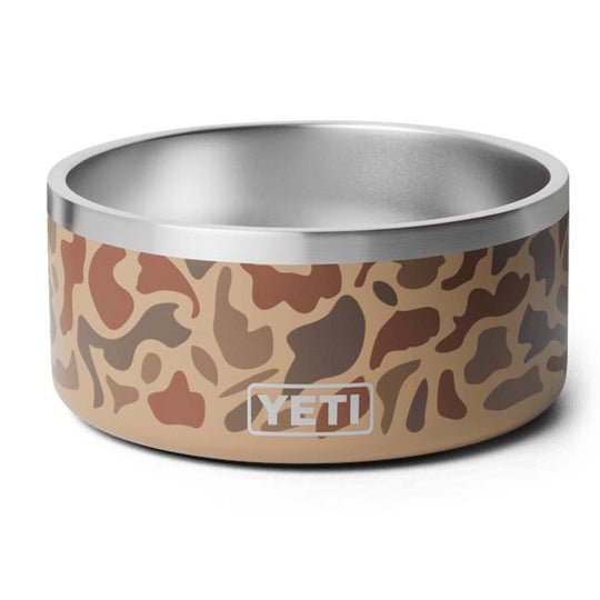 YETI Boomer 8 stainless steel dog bowl in a tan camouflage print with a non-slip base and embossed logo.