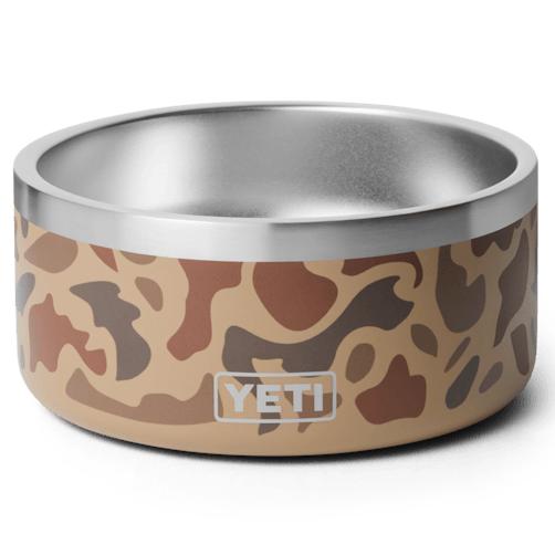YETI Boomer 4 dog bowl in tan camouflage print, featuring durable stainless steel construction and a non-slip base.