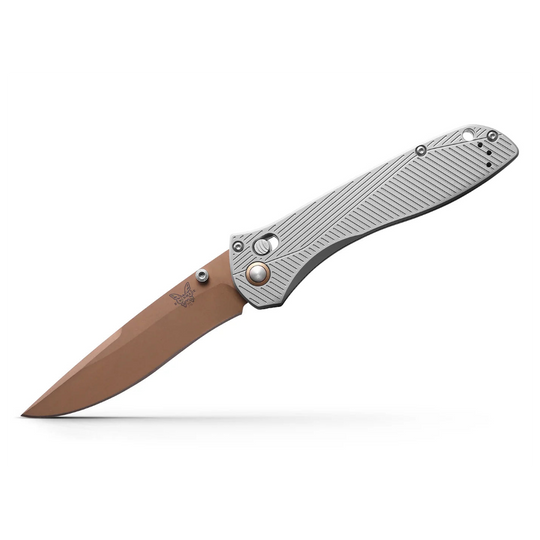 Benchmade 710 25th Anniversary folding knife with a copper-colored recurved blade and textured silver metal handle.