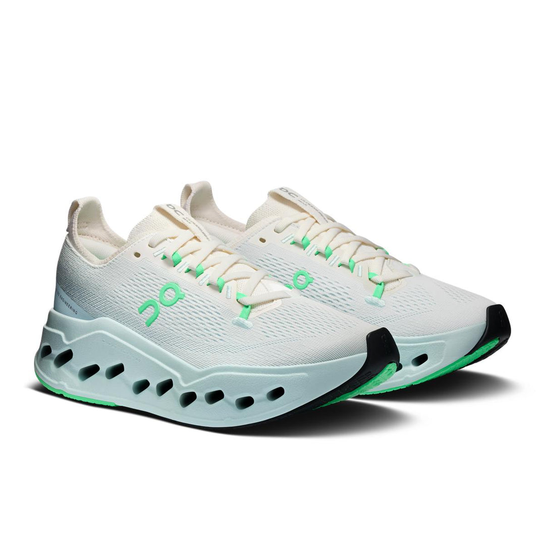 On Running Women's Cloudsurfer Max in white with mint green accents and a thick, cushioned CloudTec Phase sole.