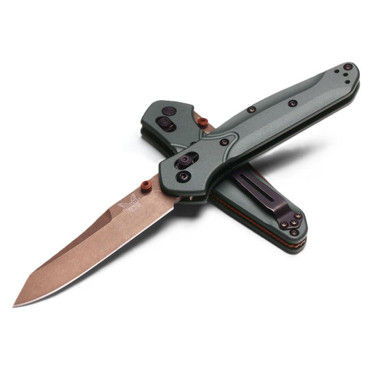 Benchmade Osborne 940 knife with a copper-colored blade and green anodized aluminum handle featuring an AXIS lock.