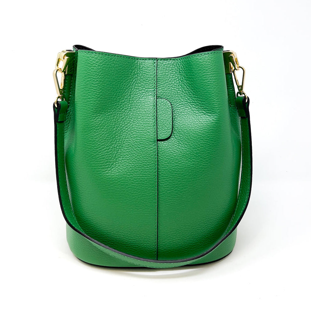 Green leather handbag on a white background
