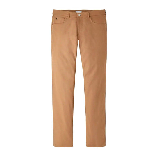 Tan Peter Millar EB66 performance five-pocket pants in stretch twill fabric with a button-front closure.