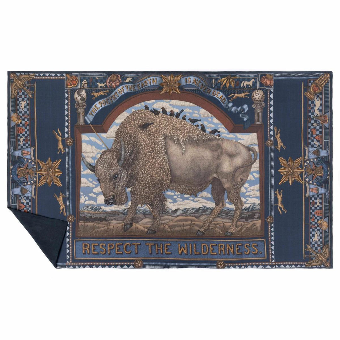 Navy blue cashmere stole featuring a central bison illustration, folk art motifs, and the text Respect the Wilderness.