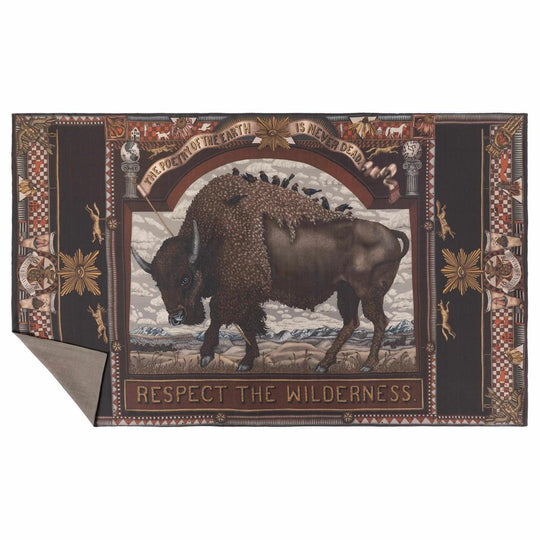 Brown cashmere stole featuring a central bison illustration, folk art motifs, and text on a dark, ornate decorative border.