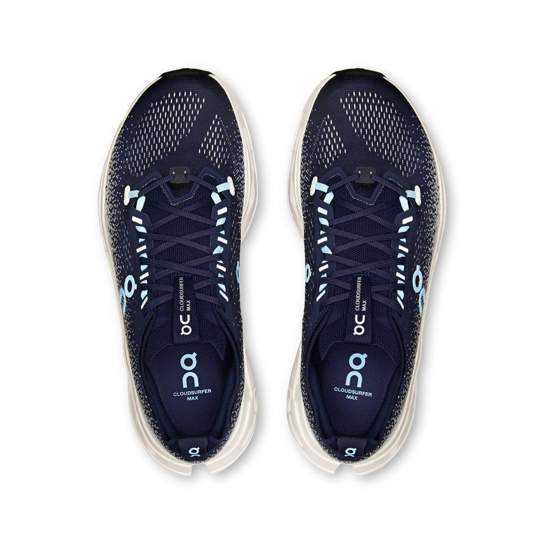 Top view of navy blue On Running Cloudsurfer Max shoes with light blue accents and thick white cushioned soles.