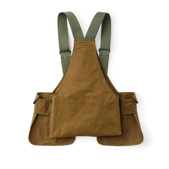 Filson Tin Cloth game bag in tan with olive webbing straps, featuring expandable shell pockets and a rear-loading design.