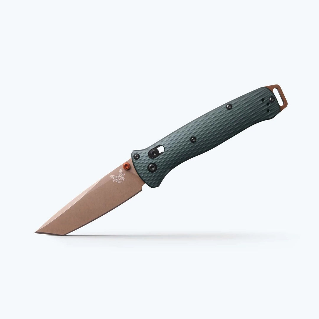 Benchmade Bailout folding knife with a bronze tanto blade, textured green Grivory handle, and aluminum pommel.