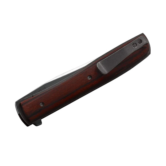Boker Plus Urban Trapper folding knife with slim cocobolo wood scales, titanium frame, and integrated pocket clip.