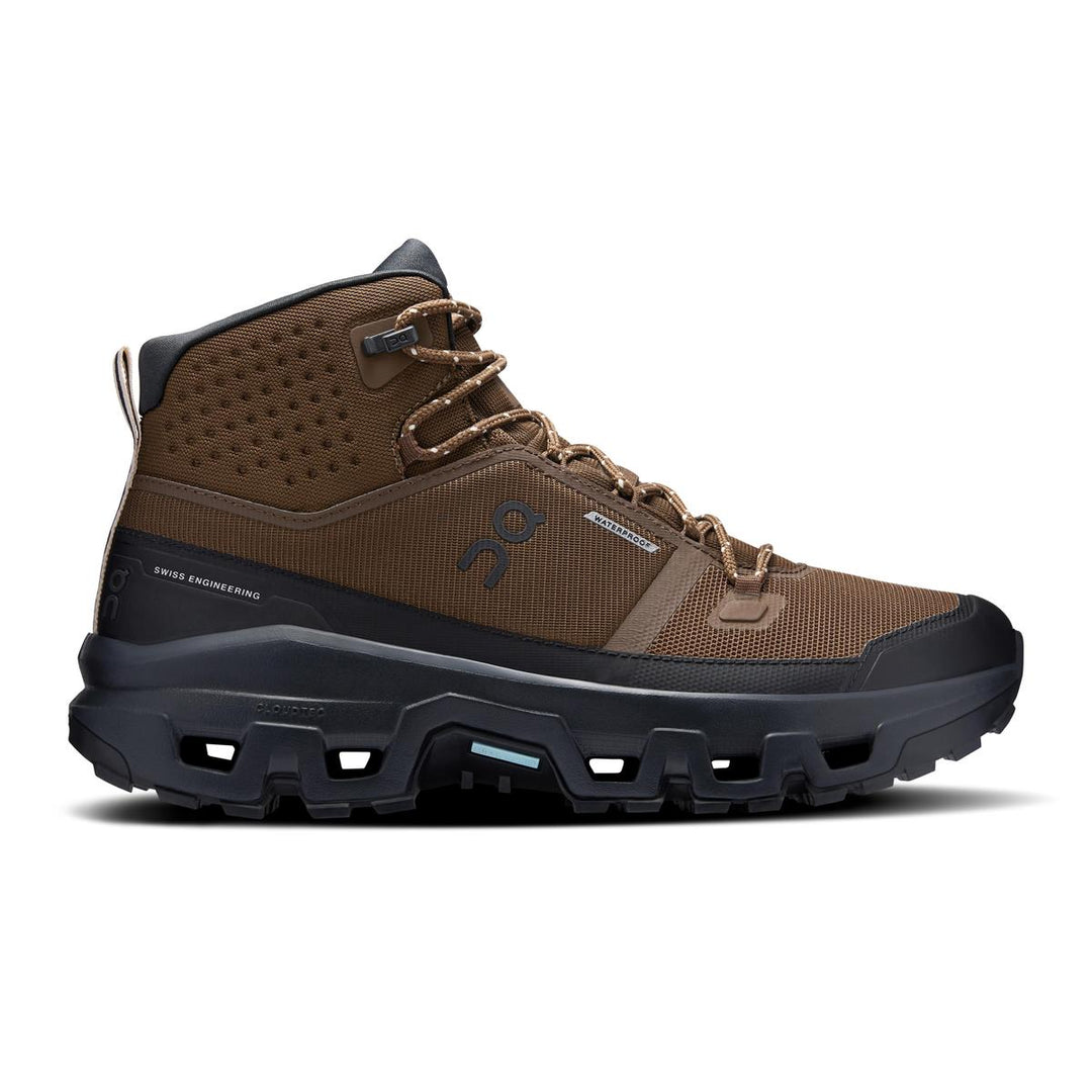 On Running Cloudrock Mid WP hiking boot in brown mesh with a black waterproof sole and rugged Mission grip traction.
