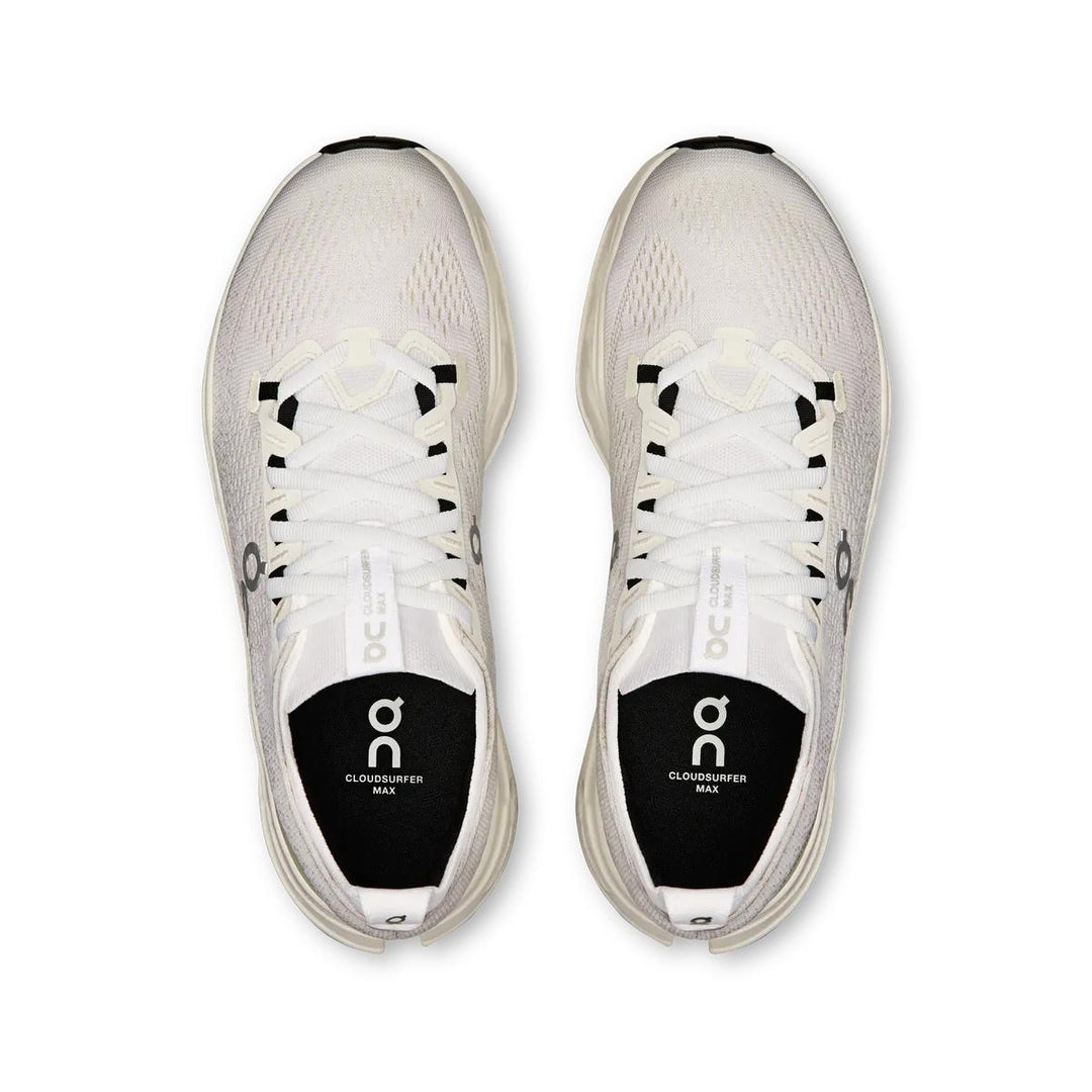 Top-down view of white On Running Cloudsurfer Max women's shoes with a breathable mesh upper and cushioned interior.