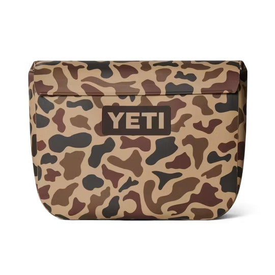 YETI Sidekick Dry 6L waterproof gear case in tan camo print with a durable, RF-welded magnetic closure design.