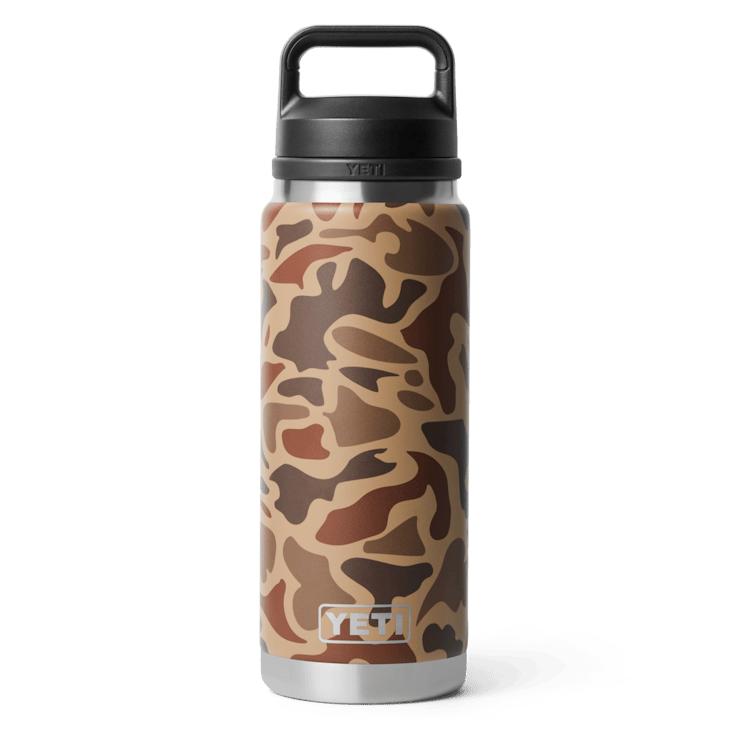 26 oz YETI Rambler bottle in brown camouflage print with a black Chug Cap and TripleHaul handle.