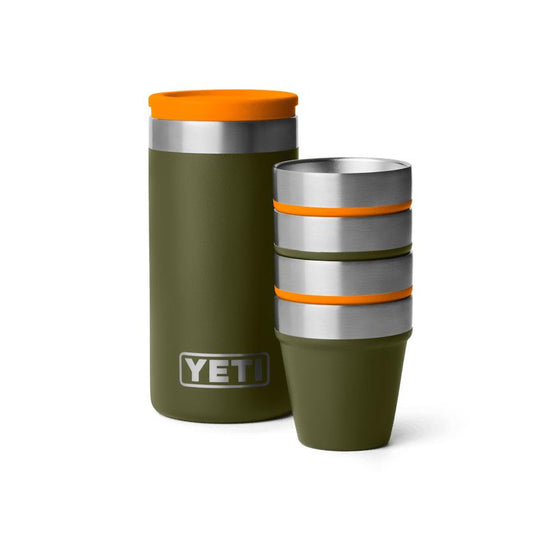 Olive green YETI shot glass set with four stackable stainless steel cups and a matching rugged carrying case.