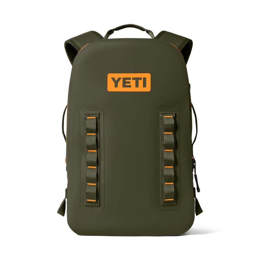 Olive green YETI Panga 28L waterproof submersible backpack with orange logo and rugged gear lash points.