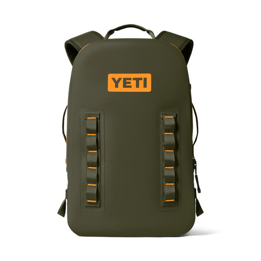 Olive green YETI Panga 28L waterproof submersible backpack with orange logo and rugged gear lash points.