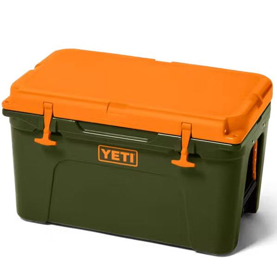 Olive green YETI Tundra 45 cooler with a bright orange lid, heavy-duty T-latches, and durable roto-molded construction.