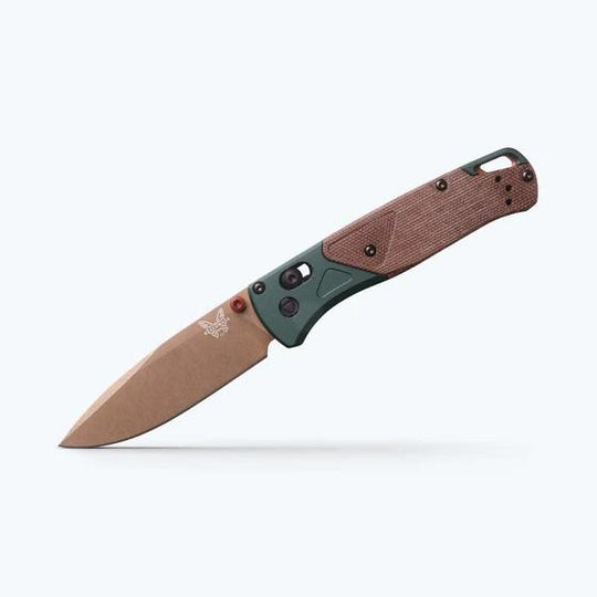 Benchmade Bugout folding knife with a tan blade, olive green bolster, and textured brown handle scales.