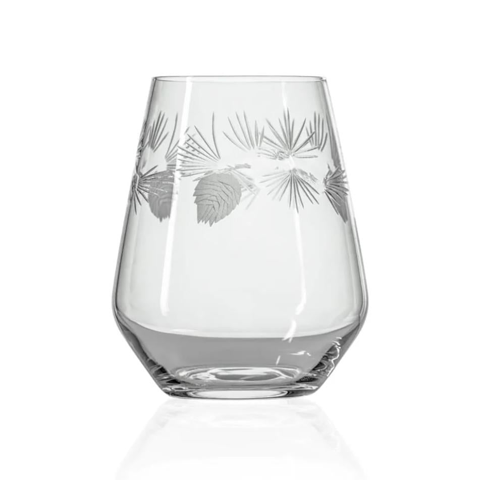 A clear stemless wine glass with a subtle gray etched pinecone and pine needle pattern around the upper half, shown on a clean white background with a soft reflection below.