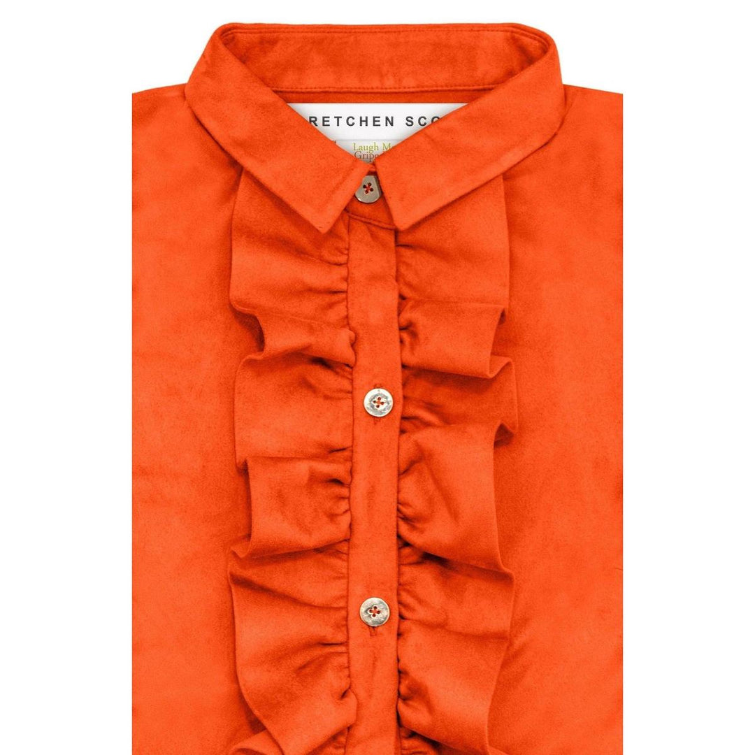 Orange ultra-suede blouse with a ruffled front placket, crisp collar, and polished gold button closures.