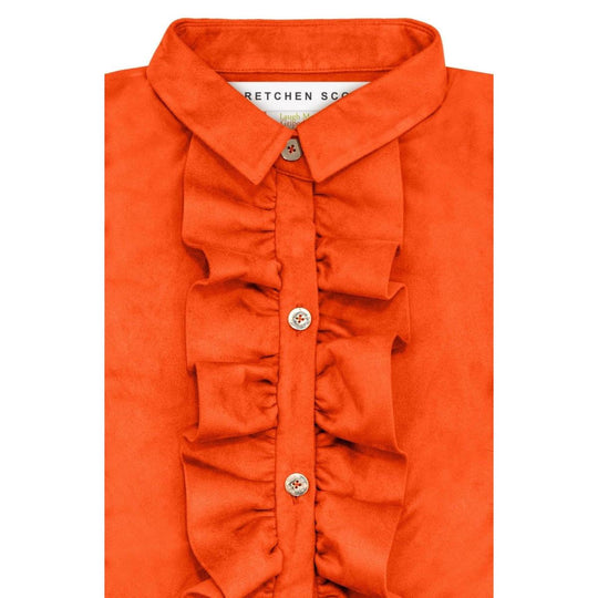 Orange ultra-suede blouse with a ruffled front placket, crisp collar, and polished gold button closures.