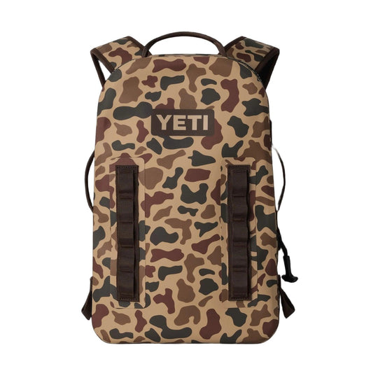 YETI Panga 28L waterproof backpack in camouflage print with ergonomic straps and durable gear loops.